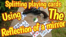 Using the reflection of a mirror to shoot playing cards with an 1873 Colt 45